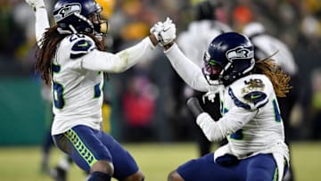 GREEN BAY, WISCONSIN - JANUARY 12: Shaquill Griffin #26 and Shaquem Griffin #49 of the Seattle Seahawks celebrate after sacking Aaron Rodgers #12 (not pictured) of the Green Bay Packers in the second half of the NFC Divisional Playoff game at Lambeau Field on January 12, 2020 in Green Bay, Wisconsin. (Photo by Quinn Harris/Getty Images)