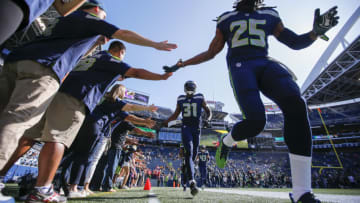 Aug 25, 2017; Seattle, WA, USA; Seattle Seahawks cornerback Richard Sherman (25) and strong safety Kam Chancellor (31) lead the secondary out onto the field for pregame warmups against the Kansas City Chiefs at CenturyLink Field. Mandatory Credit: Joe Nicholson-USA TODAY Sports