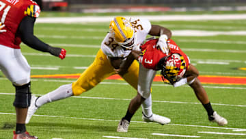 Oct 30, 2020; College Park, Maryland, USA; Minnesota Golden Gophers defensive lineman Boye Mafe (34) sacks Maryland Terrapins quarterback Taulia Tagovailoa (3) during the fourth quarter during the third quarter at Capital One Field at Maryland Stadium. Mandatory Credit: Tommy Gilligan-USA TODAY Sports