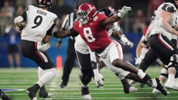 Alabama linebacker Christian Harris (8) pressures Cincinnati quarterback Desmond Ridder (9) during the 2021 College Football Playoff Semifinal game at the 86th Cotton Bowl in AT&T Stadium in Arlington, Texas Friday, Dec. 31, 2021. [Staff Photo/Gary Cosby Jr.]College Football Playoffs Alabama Vs Cincinnati