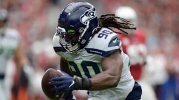 Sep 29, 2019; Glendale, AZ, USA; Seattle Seahawks outside linebacker Jadeveon Clowney (90) returns an interception for a touchdown against the Arizona Cardinals during the first half at State Farm Stadium. Mandatory Credit: Joe Camporeale-USA TODAY Sports