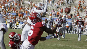 Oct 10, 2020; Dallas, TX, USA; Oklahoma's Tre Brown (6) intercepts a pass in front of Texas' Tarik Black (0) to end the Red River Showdown college football game between the Oklahoma Sooners (OU) and the Texas Longhorns (UT) at Cotton Bowl Stadium in Dallas, Saturday, Oct. 10, 2020. Oklahoma won 53-45 in four overtimes. Mandatory Credit: Bryan Terry-USA TODAY NETWORK