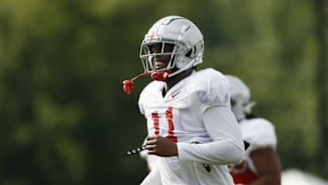 Ohio State Buckeyes defensive end Tyreke Smith (11) runs between drills during football training camp at the Woody Hayes Athletic Center in Columbus on Tuesday, Aug. 10, 2021.Ohio State Football Training Camp