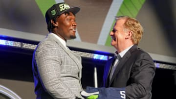 Apr 28, 2022; Las Vegas, NV, USA; Mississippi State offensive tackle Charles Cross with NFL commissioner Roger Goodell after being selected as the ninth overall pick to the Seattle Seahawks during the first round of the 2022 NFL Draft at the NFL Draft Theater. Mandatory Credit: Kirby Lee-USA TODAY Sports