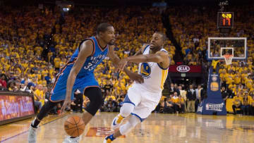 May 30, 2016; Oakland, CA, USA; Oklahoma City Thunder forward Kevin Durant (35) dribbles the basketball against Golden State Warriors forward Andre Iguodala (9) during the fourth quarter in game seven of the Western conference finals of the NBA Playoffs at Oracle Arena. The Warriors defeated the Thunder 96-88. Mandatory Credit: Kyle Terada-USA TODAY Sports