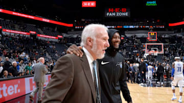 SAN ANTONIO, TX - NOVEMBER 4: Head Coach Gregg Popovich of the San Antonio Spurs and Jonathon Simmons #17 of the Orlando Magic talk after the game on November 4, 2018 at the AT&T Center in San Antonio, Texas. NOTE TO USER: User expressly acknowledges and agrees that, by downloading and/or using this photograph, user is consenting to the terms and conditions of the Getty Images License Agreement. Mandatory Copyright Notice: Copyright 2018 NBAE (Photos by Mark Sobhani/NBAE via Getty Images)
