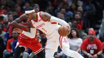 Houston Rockets forward Carmelo Anthony (7) dribbles past the defense of Chicago Bulls forward Justin Holiday (7) in the first quarter at the United Center Saturday, Nov. 3, 2018, in Chicago, Ill. (John J. Kim/Chicago Tribune/TNS via Getty Images)