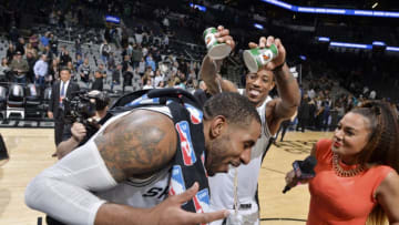 SAN ANTONIO, TX - JANUARY 10: DeMar DeRozan #10 of the San Antonio Spurs pours water on teammate LaMarcus Aldridge #12 of the San Antonio Spurs following the game agains the Oklahoma City Thunder on January 10, 2019 at the AT&T Center in San Antonio, Texas. NOTE TO USER: User expressly acknowledges and agrees that, by downloading and or using this photograph, user is consenting to the terms and conditions of the Getty Images License Agreement. Mandatory Copyright Notice: Copyright 2019 NBAE (Photos by Mark Sobhani/NBAE via Getty Images)