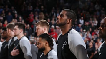 PORTLAND, OR - FEBRUARY 7: LaMarcus Aldridge #12 of the San Antonio Spurs stands for the National Anthem before the game against the Portland Trail Blazers on February 7, 2019 at the Moda Center Arena in Portland, Oregon. NOTE TO USER: User expressly acknowledges and agrees that, by downloading and or using this photograph, user is consenting to the terms and conditions of the Getty Images License Agreement. Mandatory Copyright Notice: Copyright 2019 NBAE (Photo by Sam Forencich/NBAE via Getty Images)
