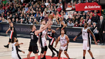PORTLAND, OR - FEBRUARY 7: Davis Bertans #42 of the San Antonio Spurs shoots the ball against the Portland Trail Blazers on February 7, 2019 at the Moda Center Arena in Portland, Oregon. NOTE TO USER: User expressly acknowledges and agrees that, by downloading and or using this photograph, user is consenting to the terms and conditions of the Getty Images License Agreement. Mandatory Copyright Notice: Copyright 2019 NBAE (Photo by Cameron Browne/NBAE via Getty Images)