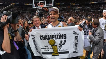 SAN ANTONIO, TX - JUNE 15: Tony Parker #9 of the San Antonio Spurs celebrates winning the 2014 NBA Championship after Game Five of the 2014 NBA Finals against the Miami Heat on June 15, 2014 at AT&T Center in San Antonio, Texas. NOTE TO USER: User expressly acknowledges and agrees that, by downloading and or using this photograph, User is consenting to the terms and conditions of the Getty Images License Agreement. Mandatory Copyright Notice: Copyright 2014 NBAE (Photo by Jesse D. Garrabrant/NBAE via Getty Images)
