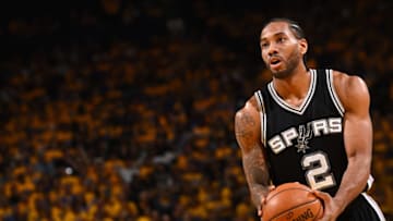 OAKLAND, CA - MAY 14: Kawhi Leonard #2 of the San Antonio Spurs shoots a free throw during the game against the Golden State Warriors during Game One of the Western Conference Finals of the 2017 NBA Playoffs on May 14, 2017 at ORACLE Arena in Oakland, California. NOTE TO USER: User expressly acknowledges and agrees that, by downloading and or using this photograph, user is consenting to the terms and conditions of Getty Images License Agreement. Mandatory Copyright Notice: Copyright 2017 NBAE (Photo by Noah Graham/NBAE via Getty Images)