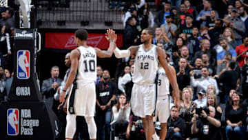 SAN ANTONIO, TX - JANUARY 10: LaMarcus Aldridge #12 of the San Antonio Spurs hi-fives DeMar DeRozan #10 of the San Antonio Spurs during the game against the Oklahoma City Thunder on January 10, 2019 at the AT&T Center in San Antonio, Texas. NOTE TO USER: User expressly acknowledges and agrees that, by downloading and or using this photograph, user is consenting to the terms and conditions of the Getty Images License Agreement. Mandatory Copyright Notice: Copyright 2019 NBAE (Photos by Mark Sobhani/NBAE via Getty Images)
