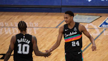 Dec 23, 2020; Memphis, Tennessee, USA; San Antonio Spurs guard DeMar DeRozan (10) and San Antonio Spurs guard Devin Vassell (24) celebrate during the second half against the Memphis Grizzlies at FedExForum. Mandatory Credit: Justin Ford-USA TODAY Sports