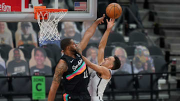 Mar 1, 2021; San Antonio, Texas, USA; Brooklyn Nets guard Landry Shamet (20) shoots over San Antonio Spurs center LaMarcus Aldridge (12) at the AT&T Center. Mandatory Credit: Daniel Dunn-USA TODAY Sports
