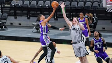 Mar 29, 2021; San Antonio, Texas, USA; Sacramento Kings guard Tyrese Haliburton (0) shoots over San Antonio Spurs center Jakob Poeltl (25) in the second half at the AT&T Center. Mandatory Credit: Daniel Dunn-USA TODAY Sports