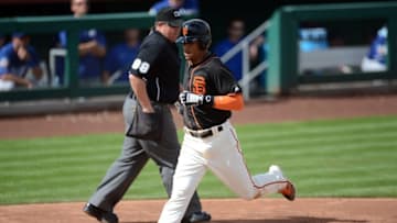 Mar 6, 2016; Scottsdale, AZ, USA; San Francisco Giants center fielder Gorkys Hernandez (66) scores on a wild pitch during the third inning against the Los Angeles Dodgers at Scottsdale Stadium. Mandatory Credit: Joe Camporeale-USA TODAY Sports