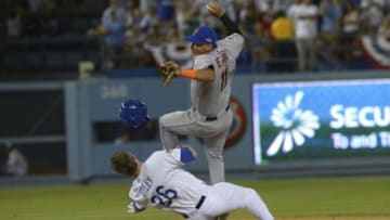 Oct 10, 2015; Los Angeles, CA, USA; New York Mets shortstop Ruben Tejada (11) collides with Los Angeles Dodgers second baseman Chase Utley (26) at second base during the seventh inning in game two of the NLDS at Dodger Stadium. Mandatory Credit: Jayne Kamin-Oncea-USA TODAY Sports