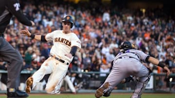 May 5, 2016; San Francisco, CA, USA; San Francisco Giants third baseman Matt Duffy (5) slides home to score against the Colorado Rockies in the first inning at AT&T Park. Mandatory Credit: John Hefti-USA TODAY Sports