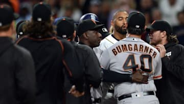 May 17, 2016; San Diego, CA, USA; San Diego Padres right fielder Matt Kemp (one from right) exchanges words with San Francisco Giants starting pitcher Madison Bumgarner (40) after the third inning as the benches cleared following an at bat by first baseman Wil Myers (not pictured) at Petco Park. Mandatory Credit: Jake Roth-USA TODAY Sports
