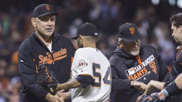 Sep 29, 2016; San Francisco, CA, USA; San Francisco Giants manager Bruce Bochy (15) congratulates relief pitcher Sergio Romo (54) after the end of the game against the Colorado Rockies at AT&T Park San Francisco Giants defeated the Colorado Rockies 7 to 2. Mandatory Credit: Neville E. Guard-USA TODAY Sports