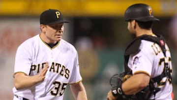 May 20, 2016; Pittsburgh, PA, USA; Pittsburgh Pirates relief pitcher Mark Melancon (35) and catcher Francisco Cervelli (29) celebrate after defeating the Colorado Rockies at PNC Park. The Pirates won 2-1. Mandatory Credit: Charles LeClaire-USA TODAY Sports