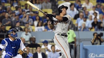 Sep 21, 2016; Los Angeles, CA, USA; San Francisco Giants shortstop Ehire Adrianza (1) looks up after hitting a solo home run during the second inning against the Los Angeles Dodgers at Dodger Stadium. Mandatory Credit: Richard Mackson-USA TODAY Sports