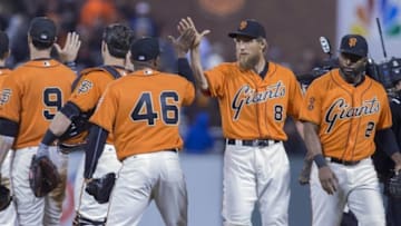 Sep 30, 2016; San Francisco, CA, USA; San Francisco Giants right fielder Hunter Pence (8) and center fielder Denard Span (2) and relief pitcher Santiago Casilla (46) and catcher Buster Posey (28) celebrate after the end of the game against the Los Angeles Dodgers at AT&T Park. The Giants defeated the Dodgers 9-3. Mandatory Credit: Neville E. Guard-USA TODAY Sports