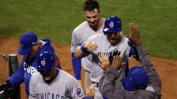 Oct 11, 2016; San Francisco, CA, USA; Chicago Cubs first baseman Anthony Rizzo (44), third baseman Kris Bryant (17) and second baseman Ben Zobrist (18) celebrate after scoring during the ninth inning of game four of the 2016 NLDS playoff baseball game against the San Francisco Giants at AT&T Park. Mandatory Credit: Kelley L Cox-USA TODAY Sports