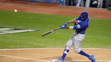 Nov 2, 2016; Cleveland, OH, USA; Chicago Cubs center fielder Dexter Fowler (24) hits a solo home run against the Cleveland Indians in the first inning in game seven of the 2016 World Series at Progressive Field. Mandatory Credit: Charles LeClaire-USA TODAY Sports
