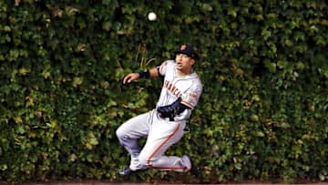 Oct 7, 2016; Chicago, IL, USA; San Francisco Giants center fielder Gorkys Hernandez (66) makes a catch for an out on a fly ball hit by Chicago Cubs catcher David Ross (not pictured) during the third inning during game one of the 2016 NLDS playoff baseball series at Wrigley Field. Mandatory Credit: Jerry Lai-USA TODAY Sports