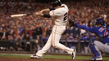 Oct 10, 2016; San Francisco, CA, USA; San Francisco Giants third baseman Conor Gillaspie (21) hits an RBI triple against the Chicago Cubs in the eighth inning during game three of the 2016 NLDS playoff baseball series at AT&T Park. Mandatory Credit: Kelley L Cox-USA TODAY Sports