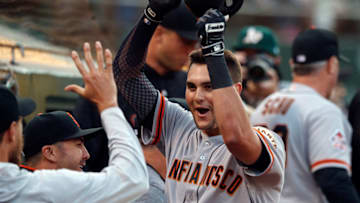 OAKLAND, CA - JULY 20: Ryder Jones #14 of the San Francisco Giants celebrates in the dugout after hitting a home run against the Oakland Athletics during the fifth inning at the Oakland Coliseum on July 20, 2018 in Oakland, California. (Photo by Jason O. Watson/Getty Images)