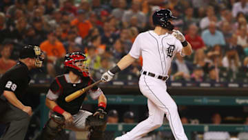 DETROIT, MI - JULY 31: Mike Gerber #13 of the Detroit Tigers hits a RBI double in the eighth inning in front of Tucker Barnhart #16 of the Cincinnati Reds at Comerica Park on July 31, 2018 in Detroit, Michigan. Detroit won the game 2-1. (Photo by Gregory Shamus/Getty Images)