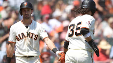 SAN FRANCISCO, CA - AUGUST 12: Brandon Crawford #35 of the San Francisco Giants is congratulated by Steven Duggar #6 after Crawford scored against the Pittsburgh Pirates in the bottom of the fourth inning at AT&T Park on August 12, 2018 in San Francisco, California. (Photo by Thearon W. Henderson/Getty Images)