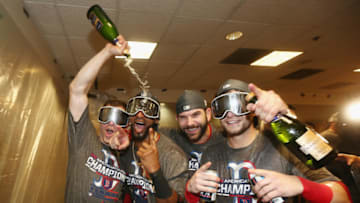 HOUSTON, TX - OCTOBER 18: (L-R) Brock Holt #12; Eduardo Nunez #36, Mitch Moreland #18, and Andrew Benintendi #16 of the Boston Red Sox celebrate in the clubhouse after defeating the Houston Astros 4-1 in Game Five of the American League Championship Series to advance to the 2018 World Series at Minute Maid Park on October 18, 2018 in Houston, Texas. (Photo by Elsa/Getty Images)
