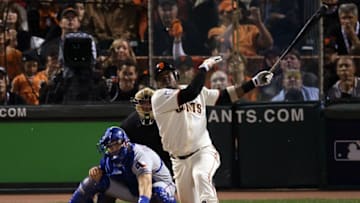 SAN FRANCISCO - OCTOBER 28: Juan Uribe #5 of the San Francisco Giants hits a RBI double in the seventh inning off Darren Oliver #28 of the Texas Rangers in Game Two of the 2010 MLB World Series at AT&T Park on October 28, 2010 in San Francisco, California. (Photo by Elsa/Getty Images)