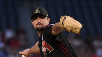 PHOENIX, ARIZONA - MAY 18: Zack Godley #52 of the Arizona Diamondbacks delivers a first inning pitch against the San Francisco Giants at Chase Field on May 18, 2019 in Phoenix, Arizona. (Photo by Norm Hall/Getty Images)