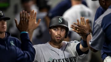 SEATTLE, WA - AUGUST 9: Tom Murphy #2 of the Seattle Mariners is congratulated by teammates in the dugout after scoring a run on a hit by Ryan Court #12 of the Seattle Mariners off of starting pitcher Jalen Beeks #68 of the Tampa Bay Rays during the fourth inning of a game at T-Mobile Park on August 9, 2019 in Seattle, Washington. (Photo by Stephen Brashear/Getty Images)
