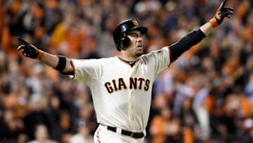 SAN FRANCISCO, CA - OCTOBER 16: Travis Ishikawa #45 of the San Francisco Giants celebrates after he hits a three-run walk-off home run to defeat the St. Louis Cardinals 6-3 during Game Five of the National League Championship Series at AT&T Park on October 16, 2014 in San Francisco, California. (Photo by Thearon W. Henderson/Getty Images)