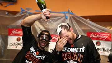 NEW YORK, NY - OCTOBER 05: Conor Gillaspie #21 and Angel Pagan #16 of the San Francisco Giants celebrate their 3-0 victory over the New York Mets in the locker room after their National League Wild Card game at Citi Field on October 5, 2016 in New York City. (Photo by Al Bello/Getty Images)