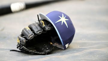 WASHINGTON, DC - JUNE 05: The Tampa Bay Rays cap and glove on the field before a baseball game against the Washington Nationals at Nationals Park on June 5, 2018 in Washington, DC. (Photo by Mitchell Layton/Getty Images)