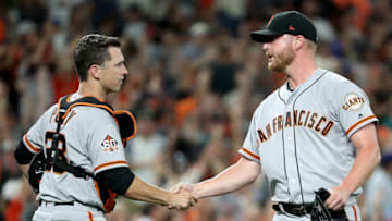 SEATTLE, WA - JULY 24: Buster Posey #28 of the San Francisco Giants (L) and Will Smith #13 of the San Francisco Giants shake hands after defeating the Seattle Mariners 4-3 during their game at Safeco Field on July 24, 2018 in Seattle, Washington. (Photo by Abbie Parr/Getty Images)