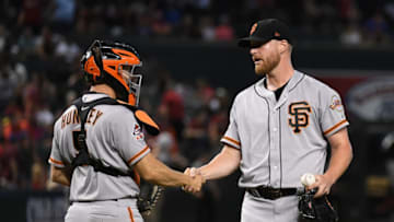 PHOENIX, AZ - AUGUST 05: Will Smith #13 and Nick Hundley #5 of the San Francisco Giants celebrate a 3-2 win against the Arizona Diamondbacks at Chase Field on August 5, 2018 in Phoenix, Arizona. (Photo by Norm Hall/Getty Images)