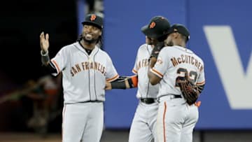 NEW YORK, NY - AUGUST 20: Alen Hanson #19,Gorkys Hernandez #7 and Andrew McCutchen #22 of the San Francisco Giants celebrate the 2-1 win over the New York Mets in the 13th inning on August 20, 2018 at Citi Field in the Flushing neighborhood of the Queens borough of New York City. (Photo by Elsa/Getty Images)