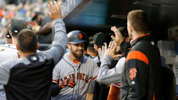 NEW YORK, NY - AUGUST 21: Evan Longoria #10 of the San Francisco Giants celebrates his first inning two run home run against the New York Mets in the dugout with his teammates at Citi Field on August 21, 2018 in the Flushing neighborhood of the Queens borough of New York City. (Photo by Jim McIsaac/Getty Images)
