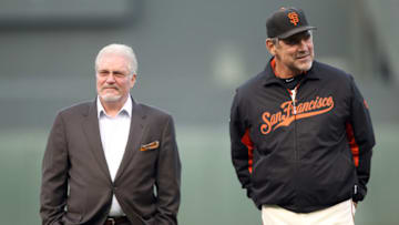 SAN FRANCISCO, CA - JUNE 09: General manager Brian Sabean and manager Bruce Bochy stand on the field before a ceremony for Edgar Renteria