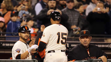 SAN FRANCISCO, CA - AUGUST 24: Carlos Beltran #15 of the San Francisco Giants is congratulated by Cody Ross #13 and manager Bruce Bochy after he hit a home run in the fourth inning against the San Diego Padres at AT&T Park on August 24, 2011 in San Francisco, California. (Photo by Ezra Shaw/Getty Images)