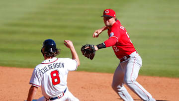 ATLANTA, GA - SEPTEMBER 30: Charlie Culberson #8 of the Atlanta Braves is forced out at second by Kyle Farmer #52 of the Cincinnati Reds in inning twelve of Game One of the National League Wild Card Series at Truist Park on September 30, 2020 in Atlanta, Georgia. (Photo by Todd Kirkland/Getty Images)