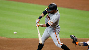 HOUSTON, TEXAS - AUGUST 12: Brandon Belt #9 of the SF Giants bats in the first inning against the Houston Astros at Minute Maid Park on August 12, 2020 in Houston, Texas. (Photo by Tim Warner/Getty Images)